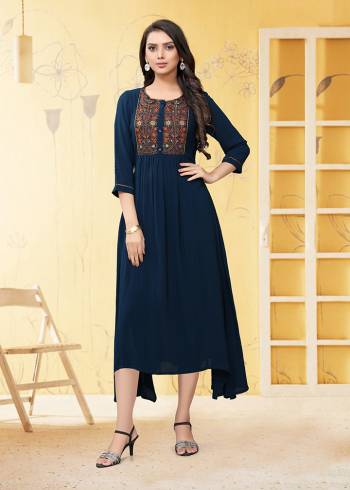 Here Is A Prefect Kurti For The Upcoming Festive Season In Navy Blue Color. This Readymade Kurti Is Fabricated On Georgette Beautified With Thread Work. It Is Light In Weight And Available In All Regular Sizes. 