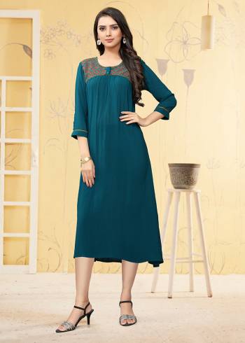 Here Is A Prefect Kurti For The Upcoming Festive Season In Teal Blue Color. This Readymade Kurti Is Fabricated On Georgette Beautified With Thread Work. It Is Light In Weight And Available In All Regular Sizes. 