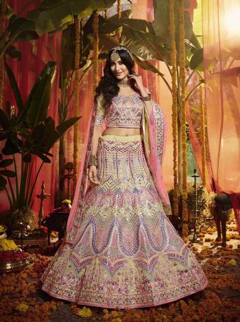 Here Is A Very Beautiful Heavy Embroidered Designer Lehenga Choli In Cream Color Paired With Contrasting Pink Colored Dupatta. Its Lovely Blouse and Lehenga are Fabricated On Orgenza Paired With  Net Fabricated Dupatta. Its Pretty Color Pallete And Attractive Embroidery Will Earn You Lots Of Compliments From Onlookers. 