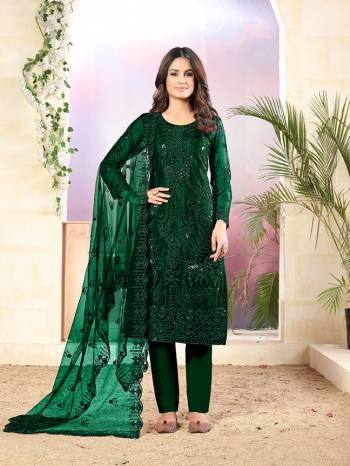 Grab This Very Pretty Designer Straight Suit In Dark Green Color Which Is Suitable For The Upcoming Wedding And Festive Season. Its Top And Dupatta Are Fabricated On Net Beautified With Elegant Tone To Tone Embroidery Paired With Santoon Bottom. 