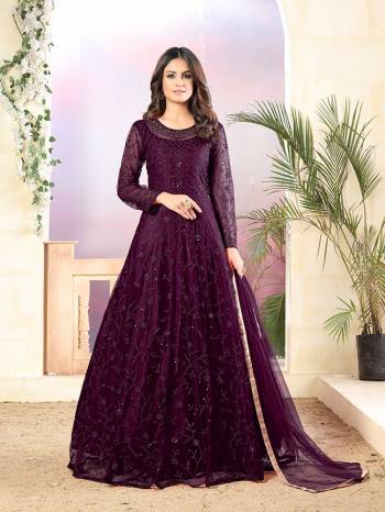 Grab This Very Beautiful Heavy Designer Floor Length Suit In Wine Color. Its Top Is Fabricated On Net Paired With Santoon Bottom and Net Fabricated Dupatta. It Is Beautified With Tone To Tone Embroidery All Over. Buy Now.