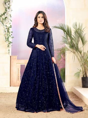 Grab This Very Beautiful Heavy Designer Floor Length Suit In Navy Blue Color. Its Top Is Fabricated On Net Paired With Santoon Bottom and Net Fabricated Dupatta. It Is Beautified With Tone To Tone Embroidery All Over. Buy Now.