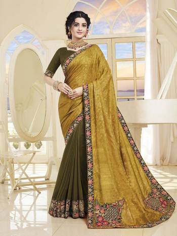 Add This Very Beautiful Designer Saree To Your Wardrobe In Yellow and Olive Green Color. This Saree and Blouse Are Silk Based Beautified With Embroidery. It Is Suitable For The Upcoming Wedding And Festive Season. 