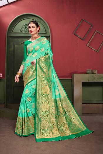 Adorn A Royal Traditional Look Wearing This Designer Silk Based saree In Sea Green And Green color. This Saree IS Fabricated On Banarasi Art Silk Paired With Art Silk Fabricated blouse. It Is Beautified With Rich Weave All Over. 