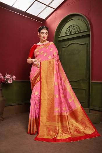 Adorn A Royal Traditional Look Wearing This Designer Silk Based saree In Pink And Red color. This Saree IS Fabricated On Banarasi Art Silk Paired With Art Silk Fabricated blouse. It Is Beautified With Rich Weave All Over. 