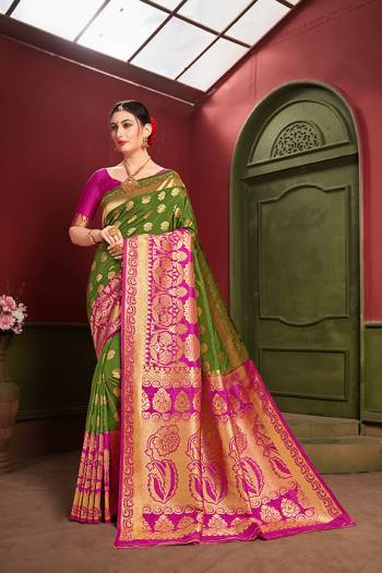 Adorn A Royal Traditional Look Wearing This Designer Silk Based saree In Green And Rani Pink color. This Saree IS Fabricated On Banarasi Art Silk Paired With Art Silk Fabricated blouse. It Is Beautified With Rich Weave All Over. 