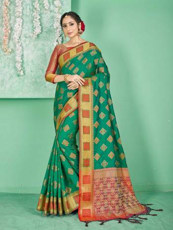 Celebrate This Festive Season Wearing This Saree In Sea Green Color Paired With Contrasting Red Colored Blouse. This Saree And Blouse Are Fabricated On Banarasi Art Silk Beautified With Weave. Buy Now.