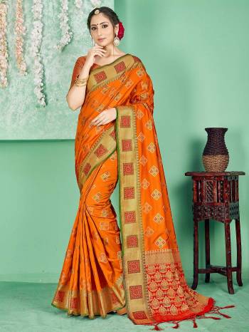 Celebrate This Festive Season Wearing This Saree In Orange Color Paired With Contrasting Red Colored Blouse. This Saree And Blouse Are Fabricated On Banarasi Art Silk Beautified With Weave. Buy Now.