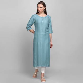 Grab This Pretty Simple And Elegant Looking Readymade Straight Kurti In Steel Blue Color. This Pretty Kurti Is Fabricated On Rayon With Self Work And Available In All Regular Sizes. 