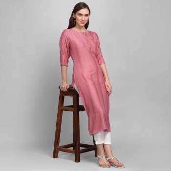 Grab This Pretty Simple And Elegant Looking Readymade Straight Kurti In Dusty Pink Color. This Pretty Kurti Is Fabricated On Rayon With Self Work And Available In All Regular Sizes. 