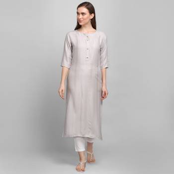 Grab This Pretty Simple And Elegant Looking Readymade Straight Kurti In Light Grey Color. This Pretty Kurti Is Fabricated On Rayon With Self Work And Available In All Regular Sizes. 