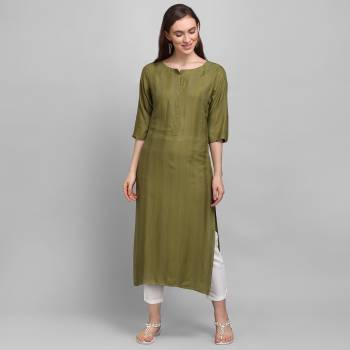 Grab This Pretty Simple And Elegant Looking Readymade Straight Kurti In Olive Green Color. This Pretty Kurti Is Fabricated On Rayon With Self Work And Available In All Regular Sizes. 