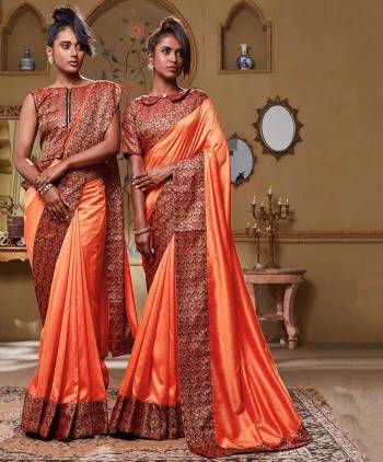 You Will Definitely Earn Lots Of Compliments Wearing This Pretty Saree In Orange Color Paired With Red Colored Blouse. This Saree Is Fabricated On Soft Art Silk Which Also Gives A Rich Look To Your Personality.