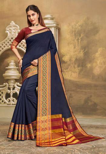 For A Decent And Formal Look, Grab This Pretty Elegant Looking Saree In Navy Blue Color Paired With Contrasting Maroon Colored Blouse. This Saree And Blouse Are Fabricated On Khadi Silk Beautified With Broad Weaved Border. 