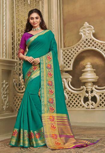 Here IS A Pretty Elegant Looking Saree In Sea Green Color Paired With Contrasting Purple Colored Blouse. This Saree And Blouse Are Fabricated On Khadi Silk Which Also Gives A Rich Look To Your Personality. 