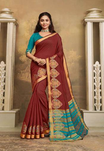 Here IS A Pretty Elegant Looking Saree In Brown Color Paired With Contrasting Blue Colored Blouse. This Saree And Blouse Are Fabricated On Khadi Silk Which Also Gives A Rich Look To Your Personality. 