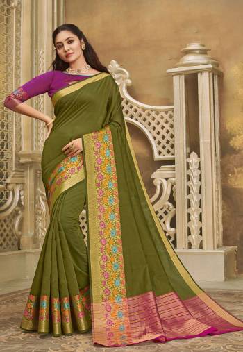 For A Decent And Formal Look, Grab This Pretty Elegant Looking Saree In Olive Green Color Paired With Contrasting Purple Colored Blouse. This Saree And Blouse Are Fabricated On Khadi Silk Beautified With Broad Weaved Border. 