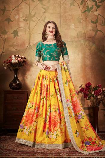 You Will Definitely Earn Lots Of Compliments Wearing This Orgenza Based Designer Lehenga Choli In Pine Green Colored Blouse Paired With Contrasting Yellow Colored Lehenga and Dupatta. Its Blouse Is Silk Based Beautified With Embroidery Paired With Orgenza Fabricated Lehenga And Dupatta Beautified With Prints.