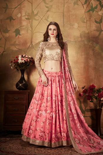 You Will Definitely Earn Lots Of Compliments Wearing This Orgenza Based Designer Lehenga Choli In Beige Colored Blouse Paired With Contrasting Pink Colored Lehenga and Dupatta. Its Blouse Is Orgenza Based Beautified With Embroidery Paired With Orgenza Fabricated Lehenga And Dupatta Beautified With Prints.