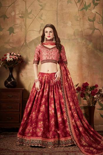 You Will Definitely Earn Lots Of Compliments Wearing This Orgenza Based Designer Lehenga Choli In Pink Colored Blouse Paired With Contrasting Maroon Colored Lehenga and Dupatta. Its Blouse Is Silk Based Beautified With Embroidery Paired With Orgenza Fabricated Lehenga And Dupatta Beautified With Prints.