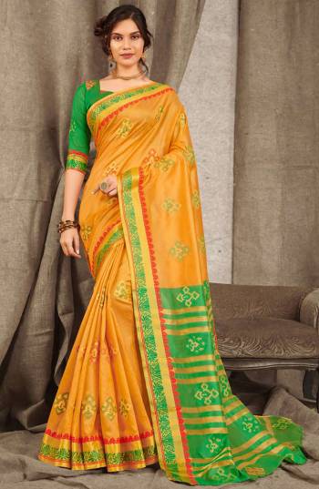 Adorn A Pretty Traditional Look Wearing This Saree In Orange Color Paired With Contrasting Green Colored blouse. This Saree And Blouse Are Fabricated On Cotton Handloom Beautified With Weave All Over. 