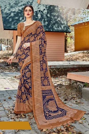 For Your Casual Or Semi-Casual Wear, Grab This Printed saree In Brown And Navy Blue Color paired With Brown Colored blouse. This Saree And Blouse Are Fabricated On Georgette Beautified With Prints. It Is Light In Weight And Easy To Carry All Day Long. 