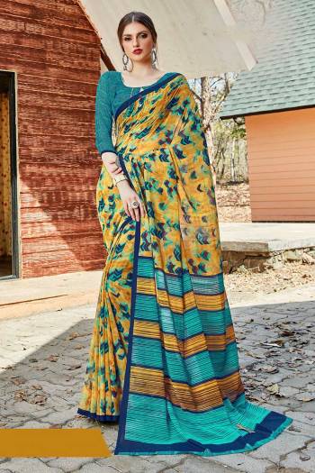 Simple And Elegant Looking Saree Is Here For Daily Wear In Yellow color paired with Blue Colored Blouse. This Saree And Blouse Are Georgette Based Which IS Light Weight And Ensures Superb Comfort All Day Long. 