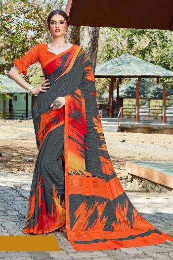 For Your Casual Or Semi-Casual Wear, Grab This Printed saree In Grey Color paired With Orange Colored blouse. This Saree And Blouse Are Fabricated On Georgette Beautified With Prints. It Is Light In Weight And Easy To Carry All Day Long. 