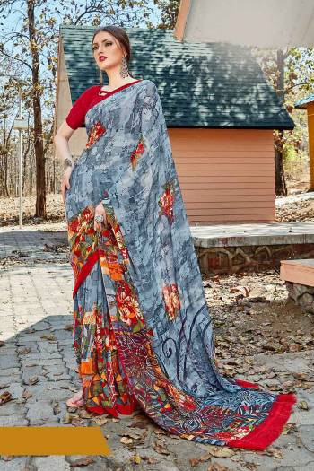 Simple And Elegant Looking Saree Is Here For Daily Wear In Grey color paired with Red Colored Blouse. This Saree And Blouse Are Georgette Based Which IS Light Weight And Ensures Superb Comfort All Day Long. 