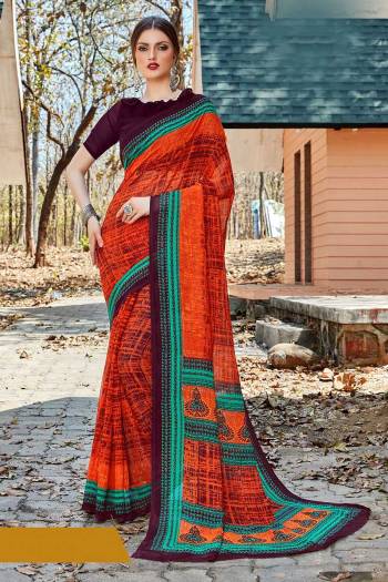 For Your Casual Or Semi-Casual Wear, Grab This Printed saree In Orange Color paired With Wine Colored blouse. This Saree And Blouse Are Fabricated On Georgette Beautified With Prints. It Is Light In Weight And Easy To Carry All Day Long. 