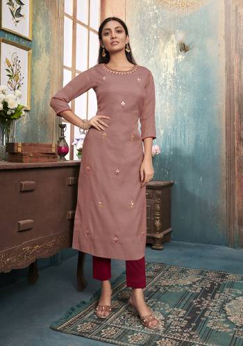 Grab This Designer Readymade Pair Of Kurti In Dusty Pink Color Paired With Maroon Colored Bottom. Its top Is Fabricated On Satin Silk Paired With Muslin Fabricated bottom. Both Its Fabrics Are Light Weight , Durable And Easy To Carry All Day Long. 