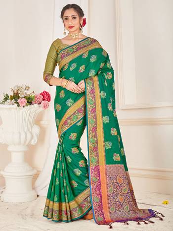 Here Is A Proper Traditional Looking Designer Silk Based saree In Green Color Paired With Green Colored Blouse. This Saree and Blouse AreFabricated On Banarasi Art Silk Beautified With Attractive Weave. 