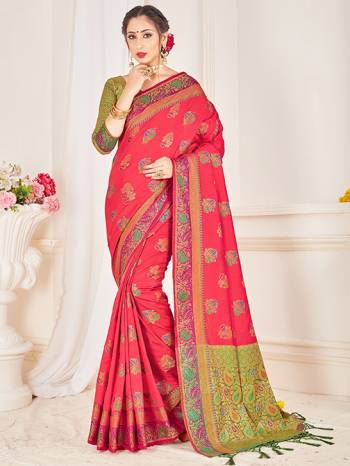 Here Is A Proper Traditional Looking Designer Silk Based saree In Rani Pink Color Paired With Green Colored Blouse. This Saree and Blouse AreFabricated On Banarasi Art Silk Beautified With Attractive Weave. 