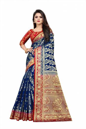 Celebrate This Festive Season In A Proper Traditonal Look Wearing This Silk Based Saree In Royal Blue Color Paired With Red Colored Blouse. This Saree And Blouse Are Fabricated On Art Silk Beautified with Weave. 