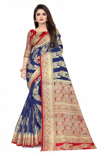 Celebrate This Festive Season In A Proper Traditonal Look Wearing This Silk Based Saree In Royal Blue Color Paired With Red Colored Blouse. This Saree And Blouse Are Fabricated On Art Silk Beautified with Weave. 