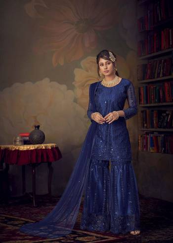 You Will Definitely Earn Lots Of Compliments Wearing This Beautiful Designer sharara Suit In Royal Blue color. Its Top, Bottom and Dupatta Are Fabricated On Net Beautified With Pretty Tone To Tone Embroidery. Its Top Is Semi-Stitched With Fully Stitched Sharara. Buy Now.