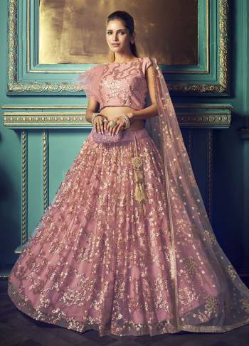 Get Ready For The Upcoming Wedding and Festive Season Wearing This Heavy Designer Lehenga Choli In Pink Color. Its Blouse And Lehenga Are Fabricated On Net Beautified With Heavy Attractive Embroidery. 