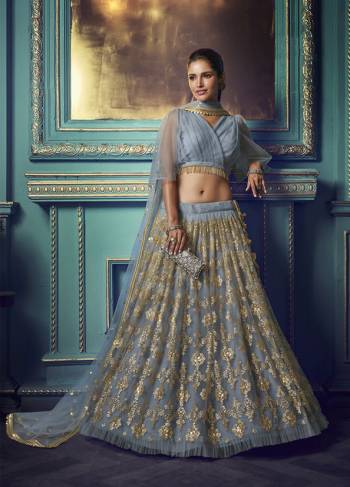 Here Is A Very Pretty Heavy Designer Lehenga Choli In Powder Blue Color. Its Pretty Heavy Embroidered Lehenga, Choli And Dupatta Are Fabricated On Net. Its Fabric, Color And Embroidery Will Earn You Lots Of Compliments From Onlookers. 