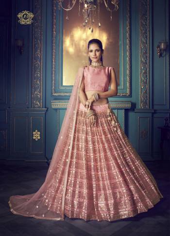 Here Is A Very Pretty Heavy Designer Lehenga Choli In Pink Color. Its Pretty Heavy Embroidered Lehenga, Choli And Dupatta Are Fabricated On Net. Its Fabric, Color And Embroidery Will Earn You Lots Of Compliments From Onlookers. 