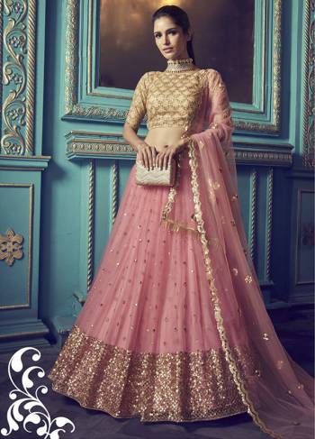 Get Ready For The Upcoming Wedding and Festive Season Wearing This Heavy Designer Lehenga Choli In Pink Color. Its Blouse And Lehenga Are Fabricated On Net Beautified With Heavy Attractive Embroidery. 