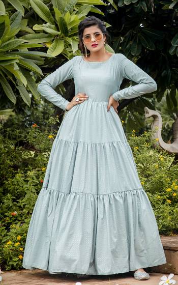 Celebrate This Festive Season Wearing This Designer Floor Length Gown In Pastel Blue Color Fabricated On Silk Blend Beautified With Prints. Buy This Semi-Stitched Gown Now.