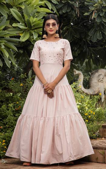 Grab This Designer Floor Length Gown In Pastel Pink Color Fabricated On Cotton. This Pretty Gown Is Beautified With Prints, Also It Is Light In Weight And Easy To Carry All Day Long. 