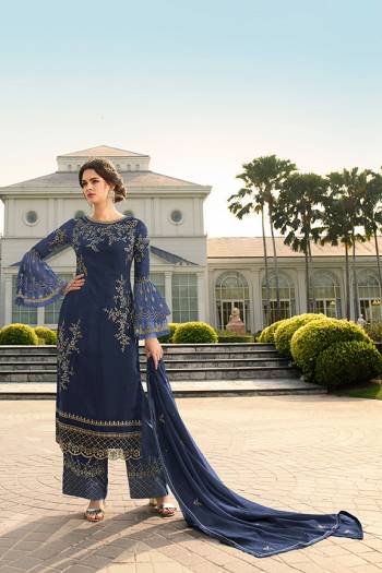 Look Beautiful Wearing This Heavy Designer Straight Suit In Navy Blue Color. This Pretty Embroidered Top And Dupatta Are Georgette Based Paired With Santoon Fabricated Embroidered Bottom. Buy This Designer Piece Now.