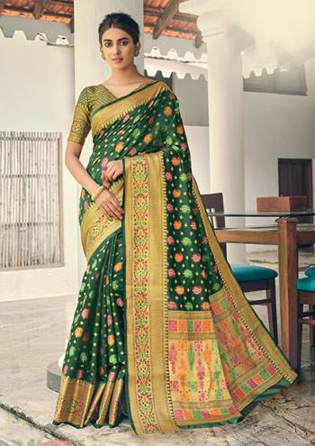 Celebrate This Festive Season Wearing This Pretty Saree In Dark Green Color. This Saree And Blouse Are Fabricated On Banarasi Art Silk Beautified With Weave All Over. 