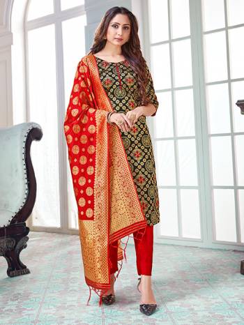 Here Is A Rich And Elegant Looking Silk Based Straight Suit In Black Colored Top Paired With Red Colored Bottom And Dupatta. Its Top And Dupatta Are Fabricated On Banarasi Silk Paired with Art Silk Bottom. 