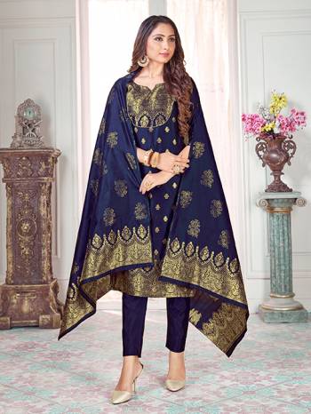 Here Is A Rich And Elegant Looking Silk Based Straight Suit In Navy Blue Color. Its Top And Dupatta Are Fabricated On Banarasi Silk Paired with Art Silk Bottom. 