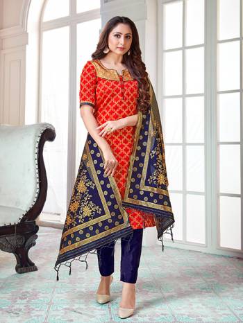 Here Is A Rich And Elegant Looking Silk Based Straight Suit In Red Colored Top Paired With Navy Blue Colored Bottom And Dupatta. Its Top And Dupatta Are Fabricated On Banarasi Silk Paired with Art Silk Bottom. 