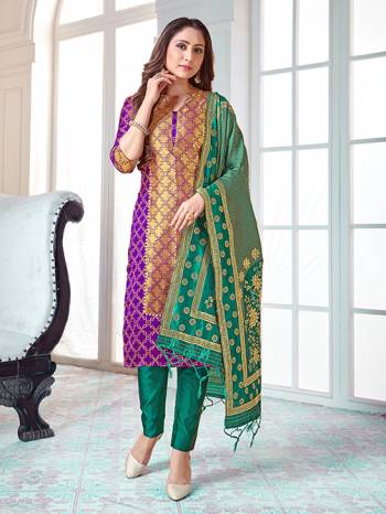 Here Is A Rich And Elegant Looking Silk Based Straight Suit In Purple Colored Top Paired With Sea Green Colored Bottom And Dupatta. Its Top And Dupatta Are Fabricated On Banarasi Silk Paired with Art Silk Bottom. 