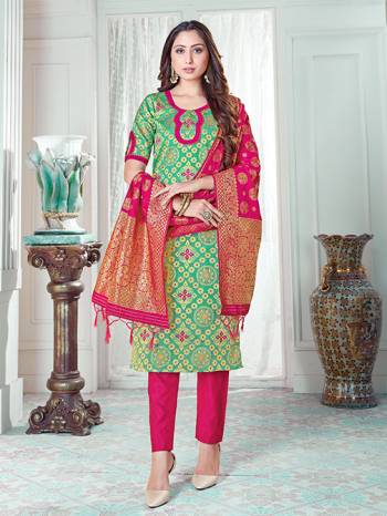 Here Is A Rich And Elegant Looking Silk Based Straight Suit In Sea Green Colored Top Paired With Rani Pink Colored Bottom And Dupatta. Its Top And Dupatta Are Fabricated On Banarasi Silk Paired with Art Silk Bottom. 