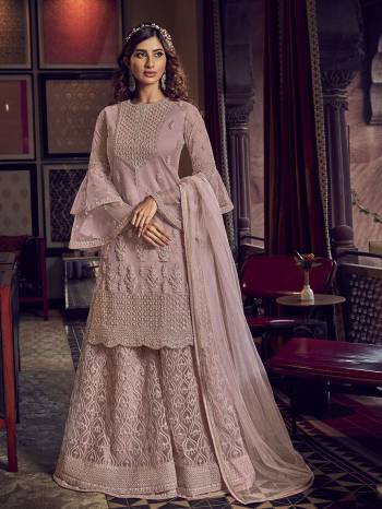 Look Pretty In This Heavy Designer Shararar Suit In Dusty Pink Color. Its Beautiful Top, Bottom and Dupatta Are Fabricated On Net Beautified With Heavy Detailed Embroidery. Its Pretty Color And Embroidery Will Earn You Lots Of compliments From Onlookers. 